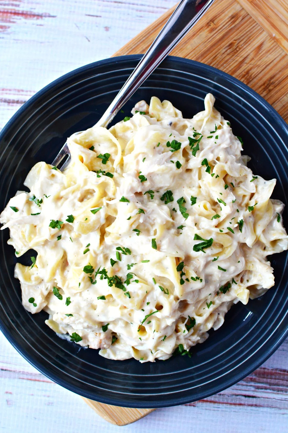 chicken dinner on a plate with noodles.