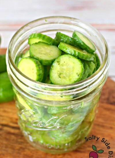 sliced cucumbers with ranch in a mason jar.