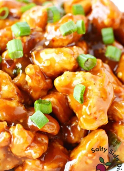 close up of orange chicken pieces.