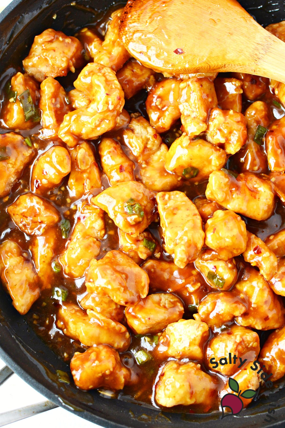 stirring sauce and chicken.