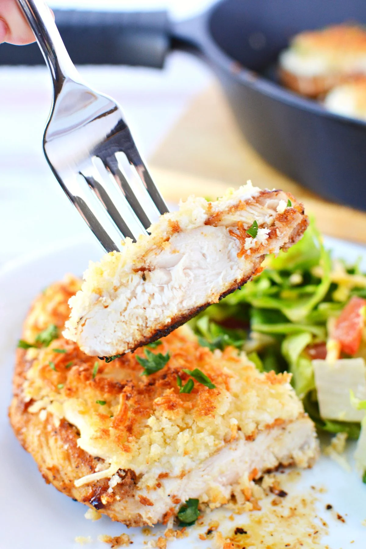 bite of chicken on a fork.