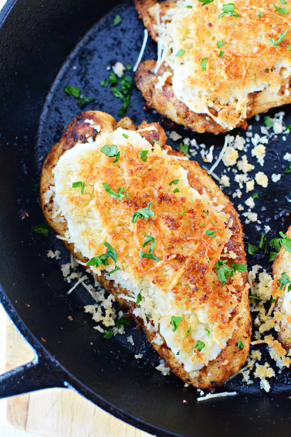 ranch parmesan chicken in cast iron pan.