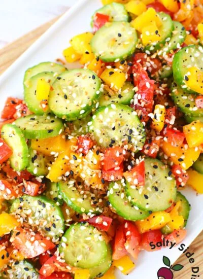 everything bagel cucumber and bell pepper salad on a plate.