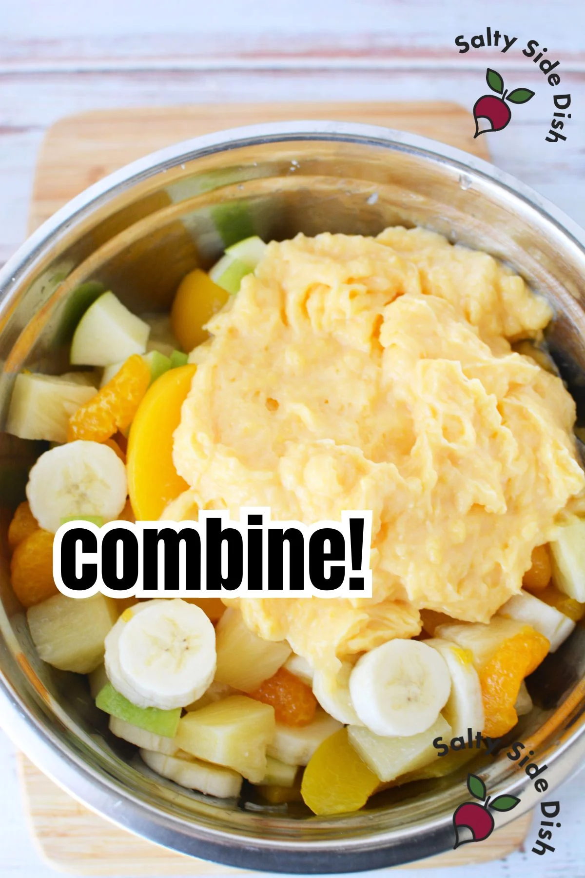 adding dreamsicle mixture to all of the fruit.