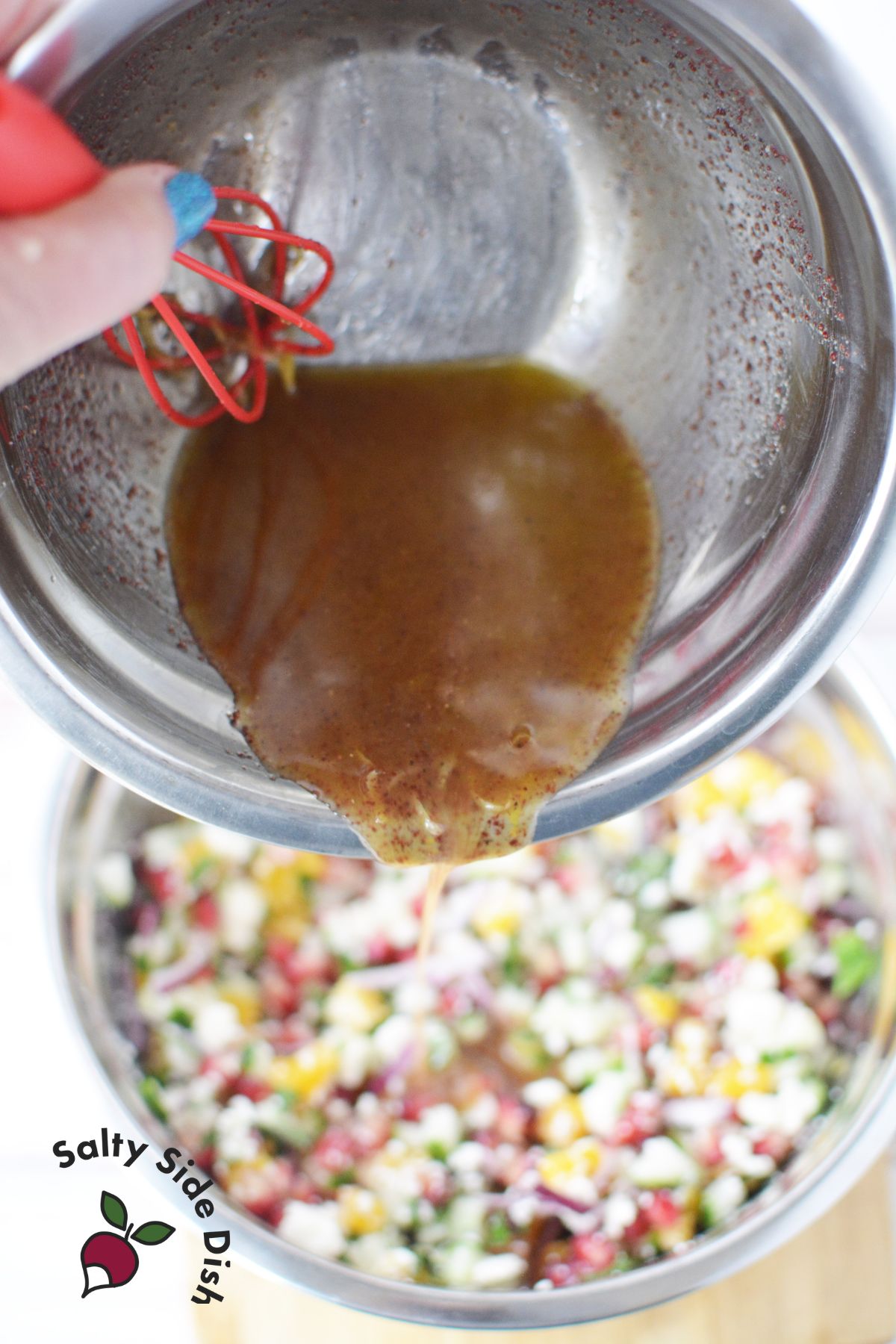 pouring lemon honey dressing on the dip.