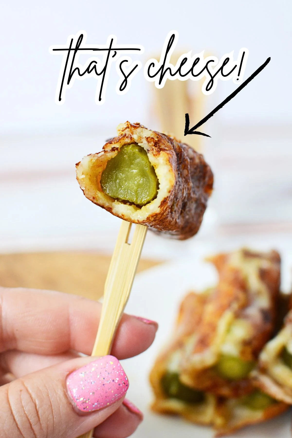 melted cheese around a dill pickle.