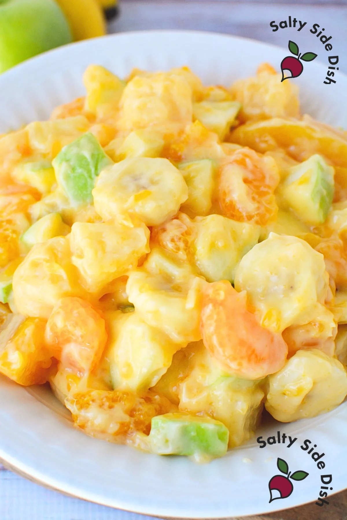 dreamlike fruit salad with oranges and creamy sweet dessert dressing with pudding and yogurt.
