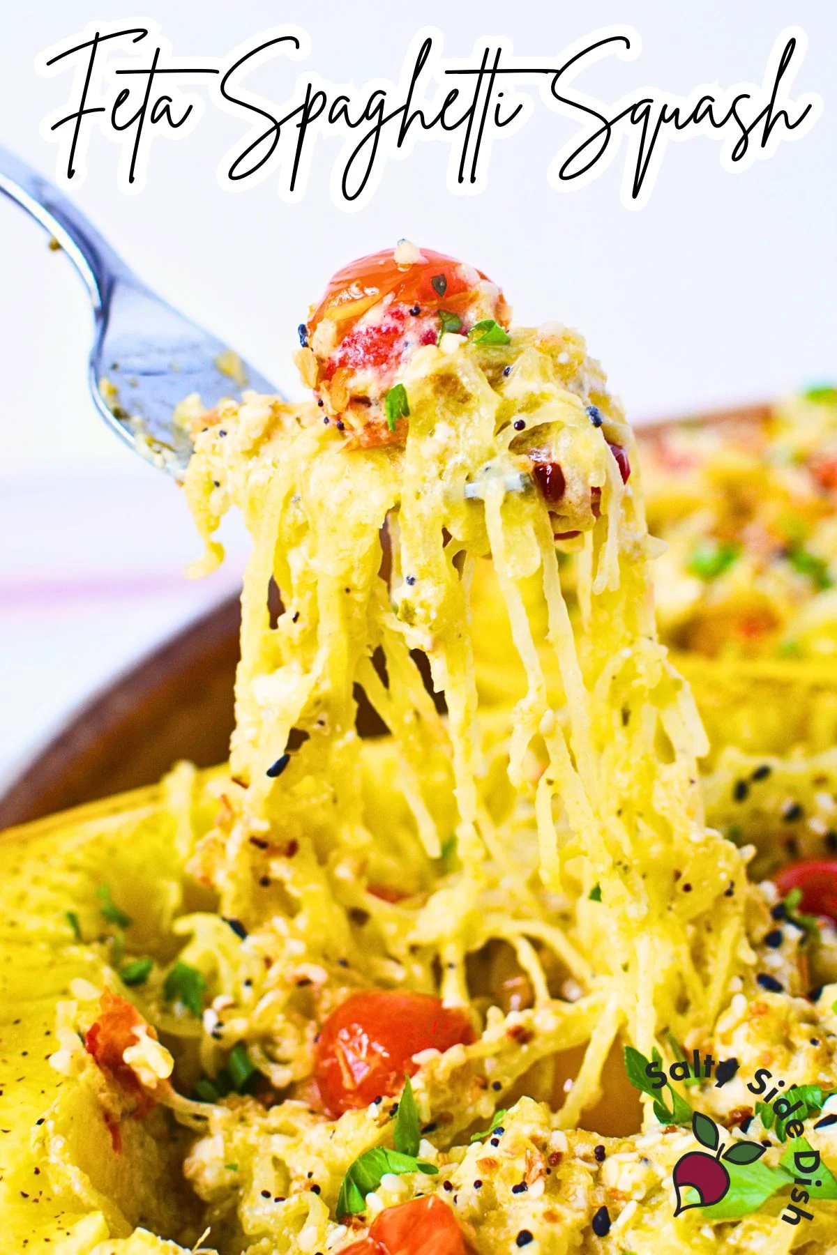 Baked feta spaghetti squash with cherry tomatoes and pesto.