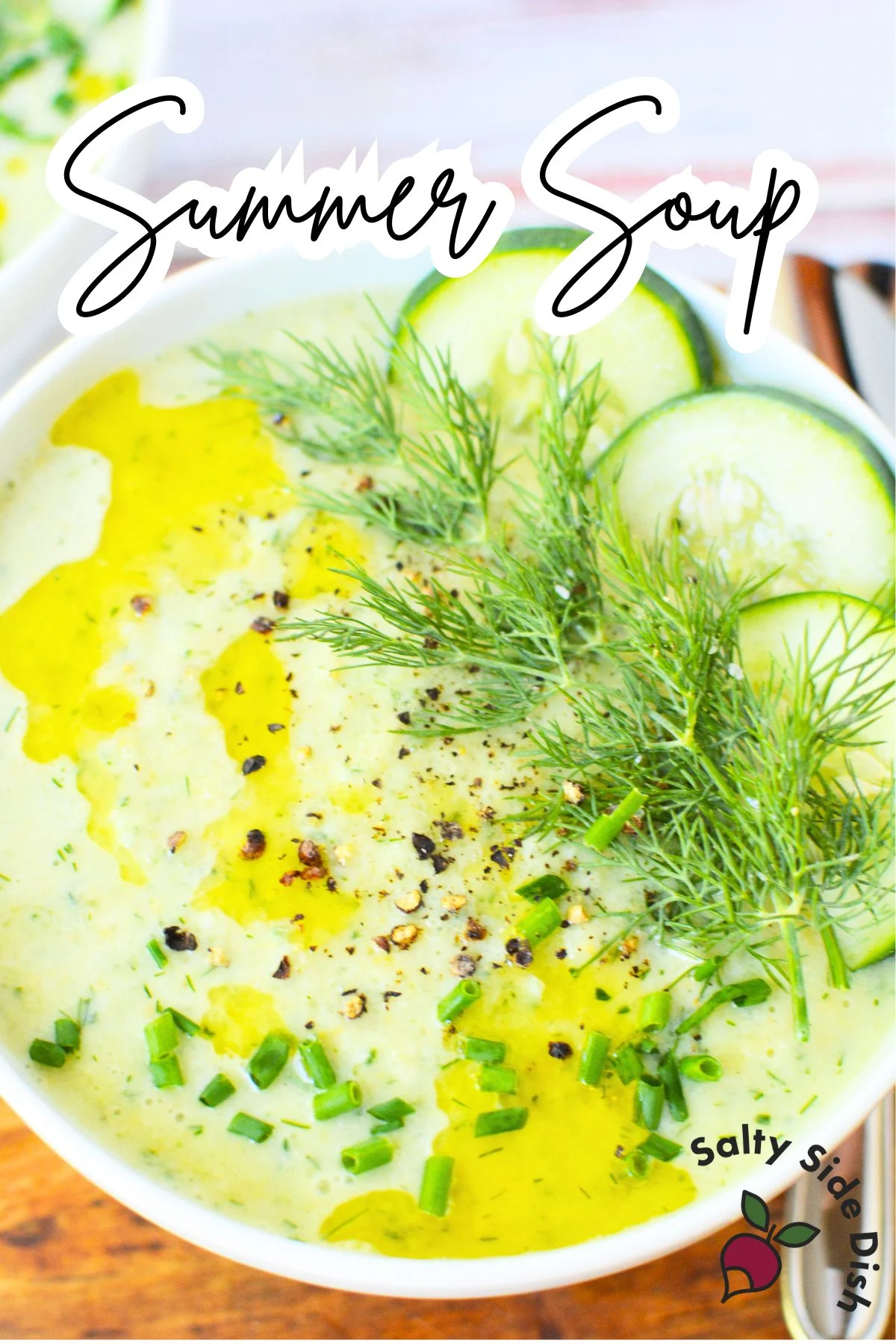 Cucumber gazpacho garnished with fresh dill and olive oil.