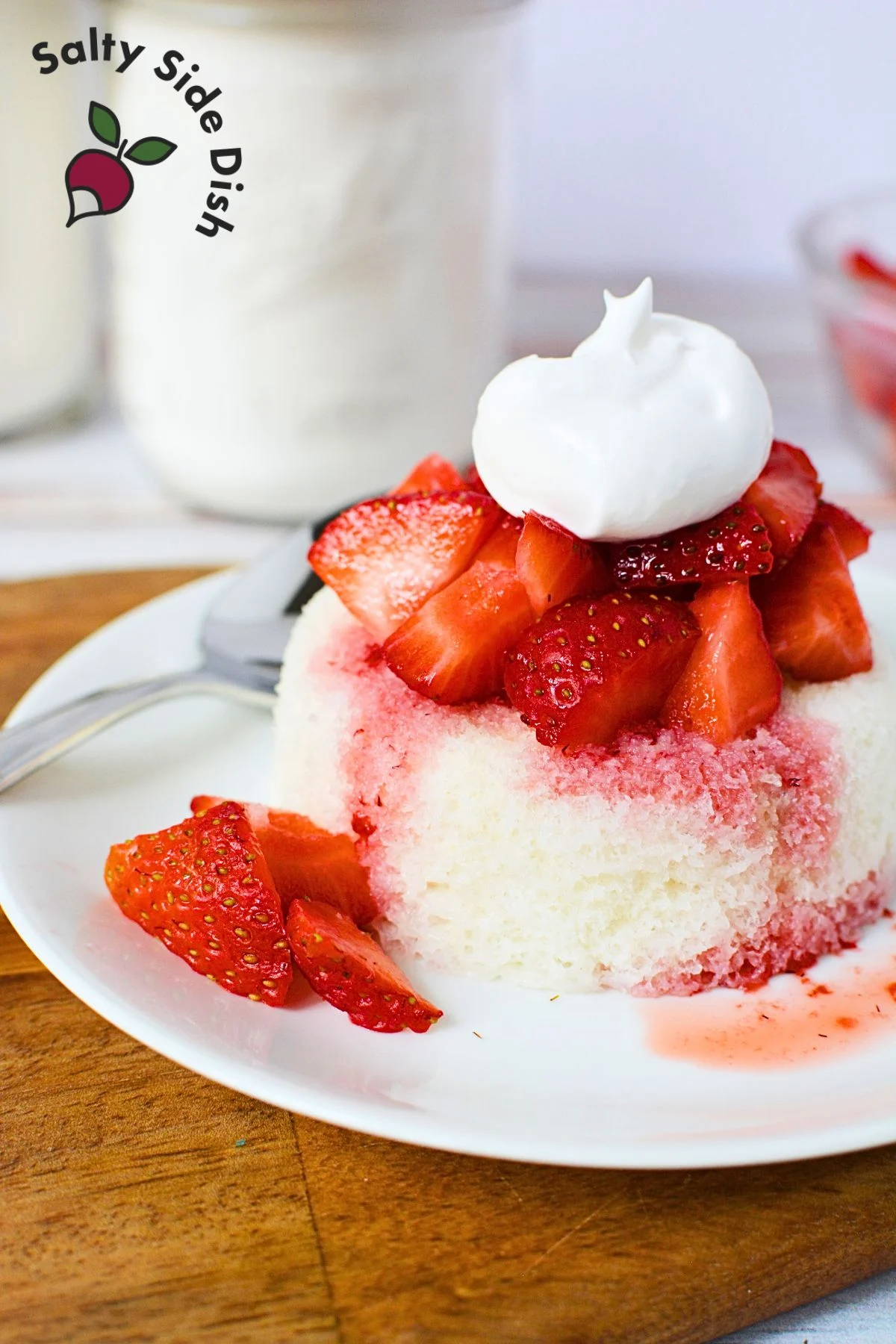 plate of strawberry shortcake with whipped cream.