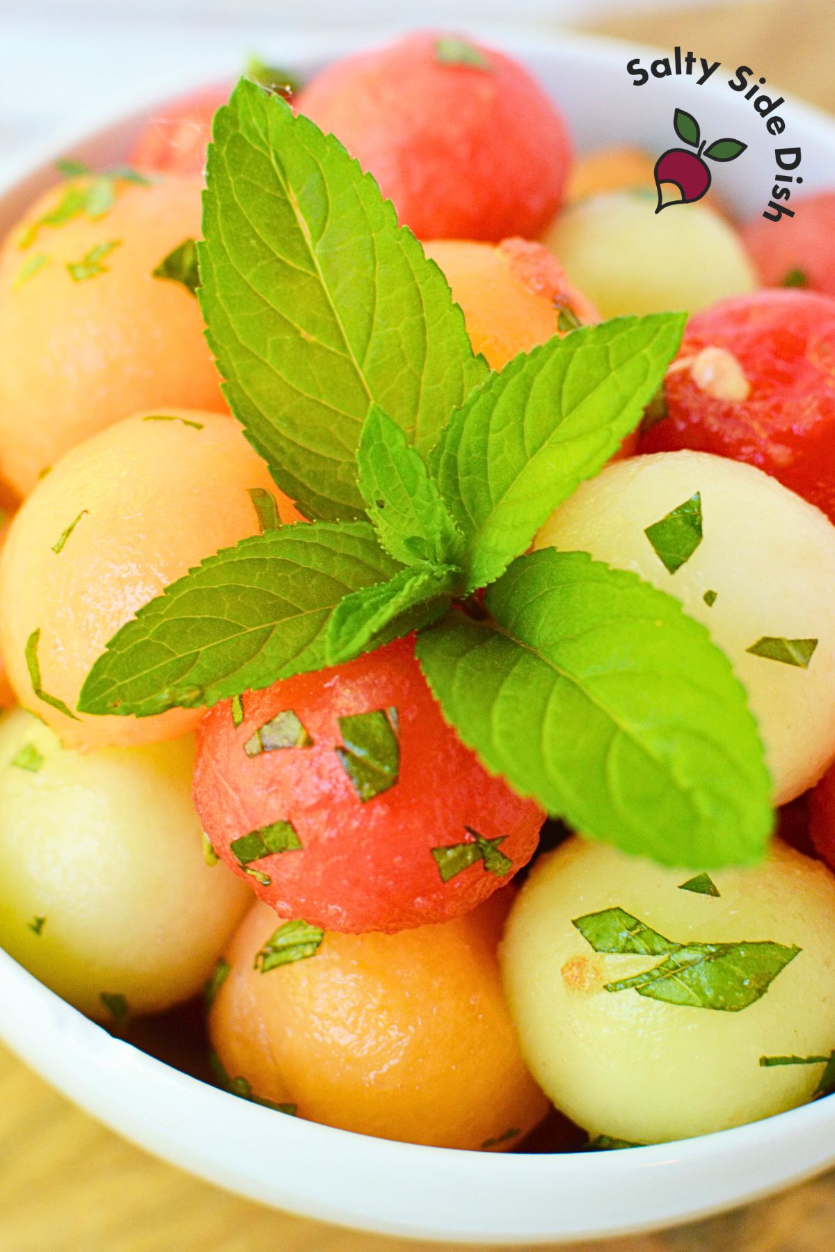 melon fruit salad with mint leaves.