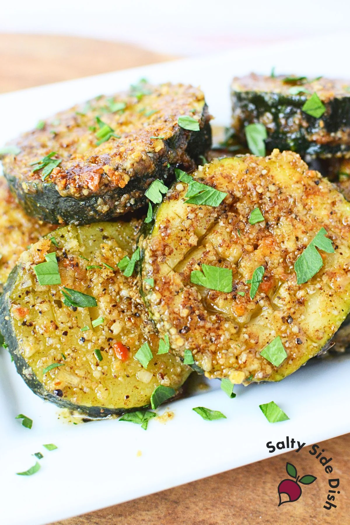 Zucchini rounds topped with melted parmesan cheese.