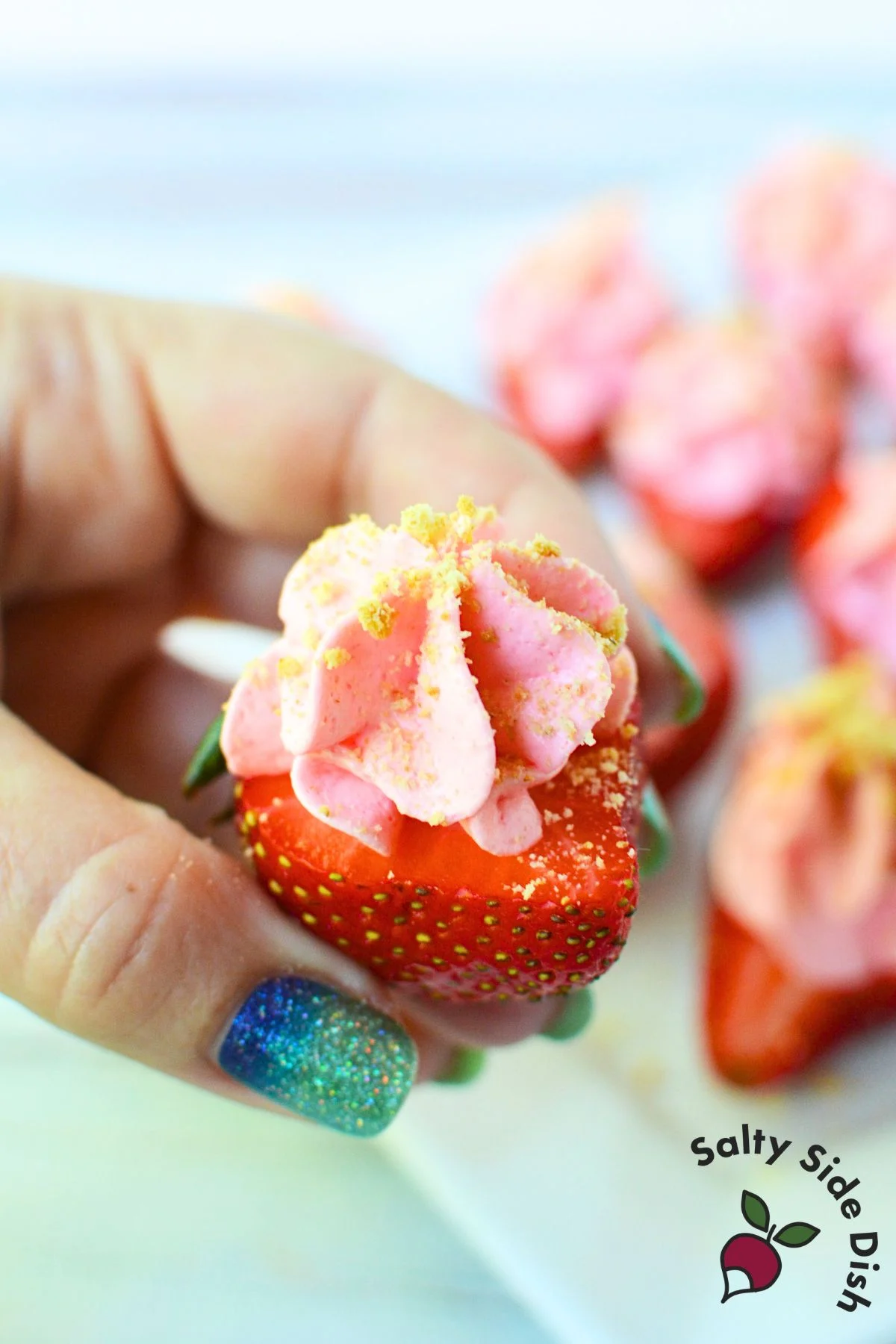 Strawberries garnished with graham cracker crumbs