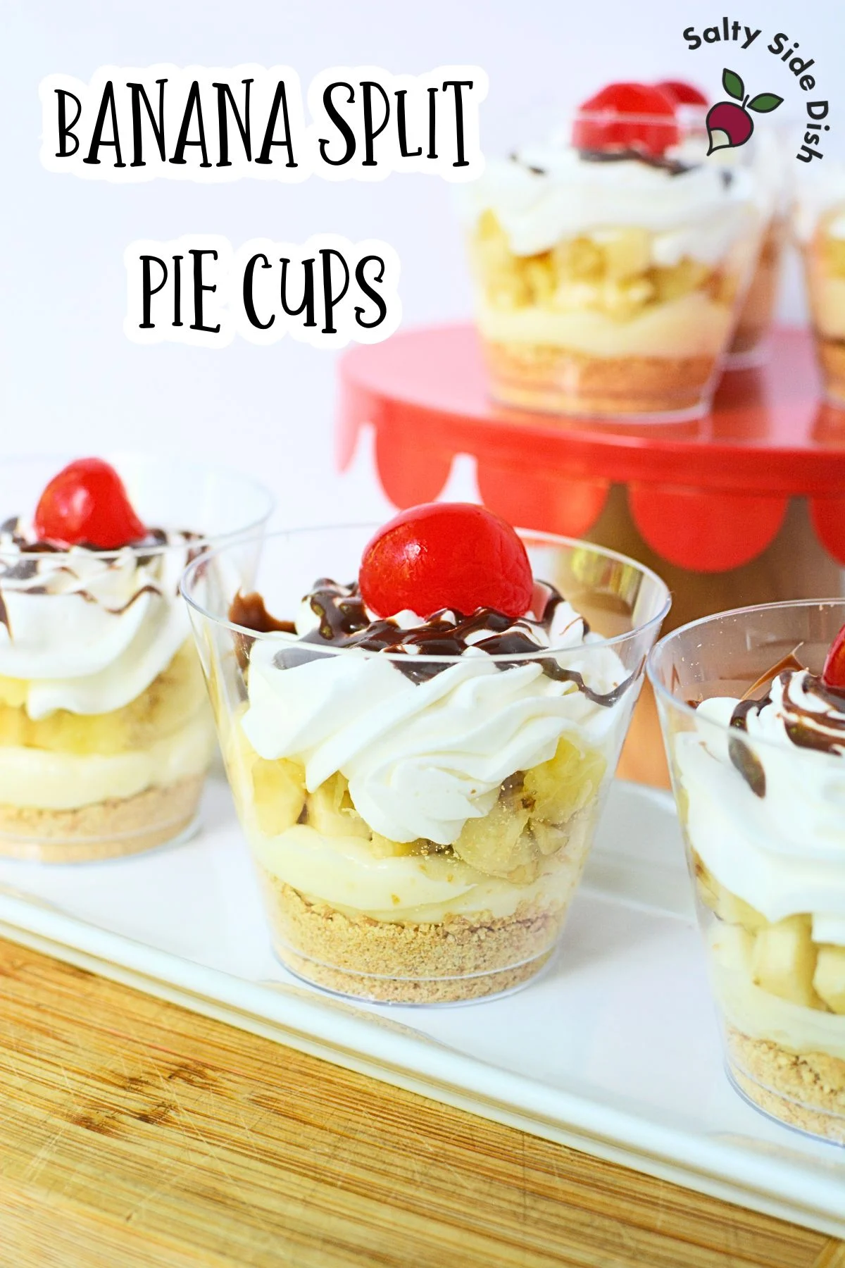 banana split pie cups with cherry on top.