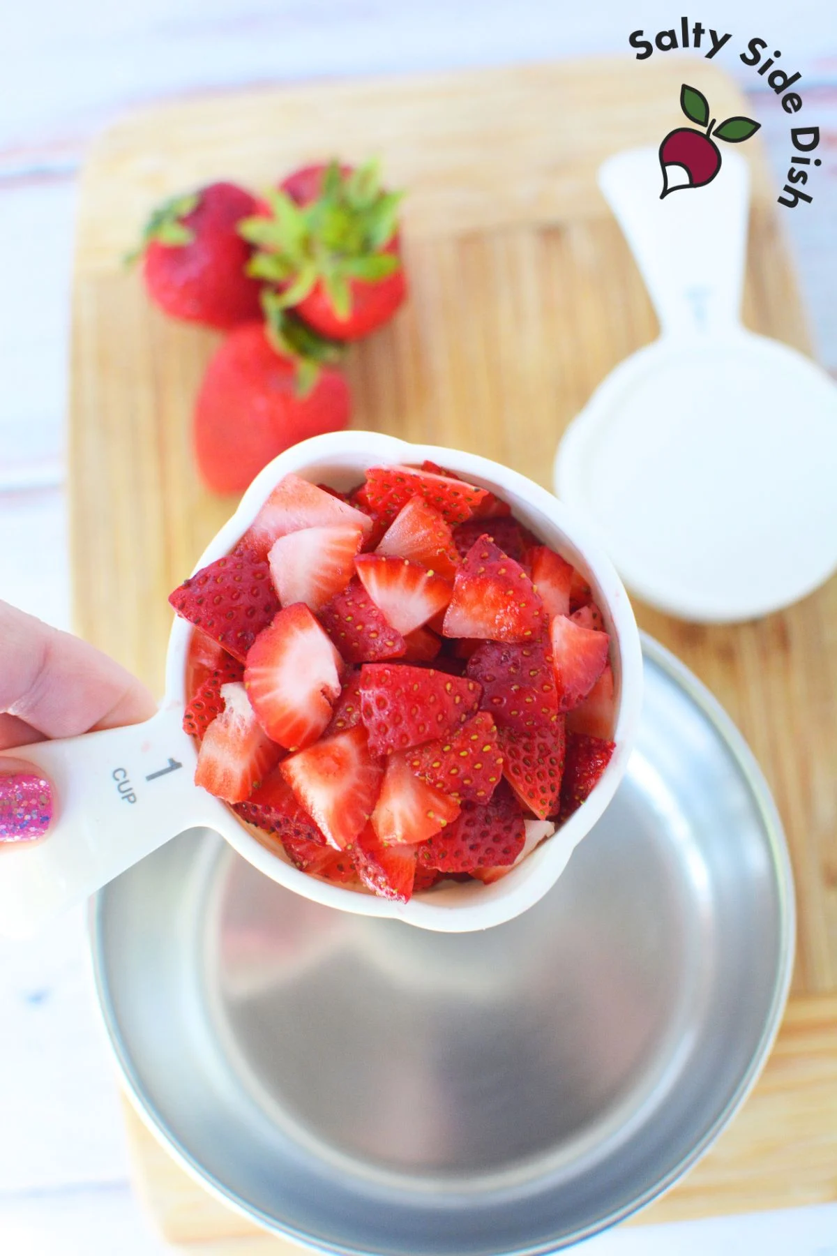 chopped strawberries in a cup.