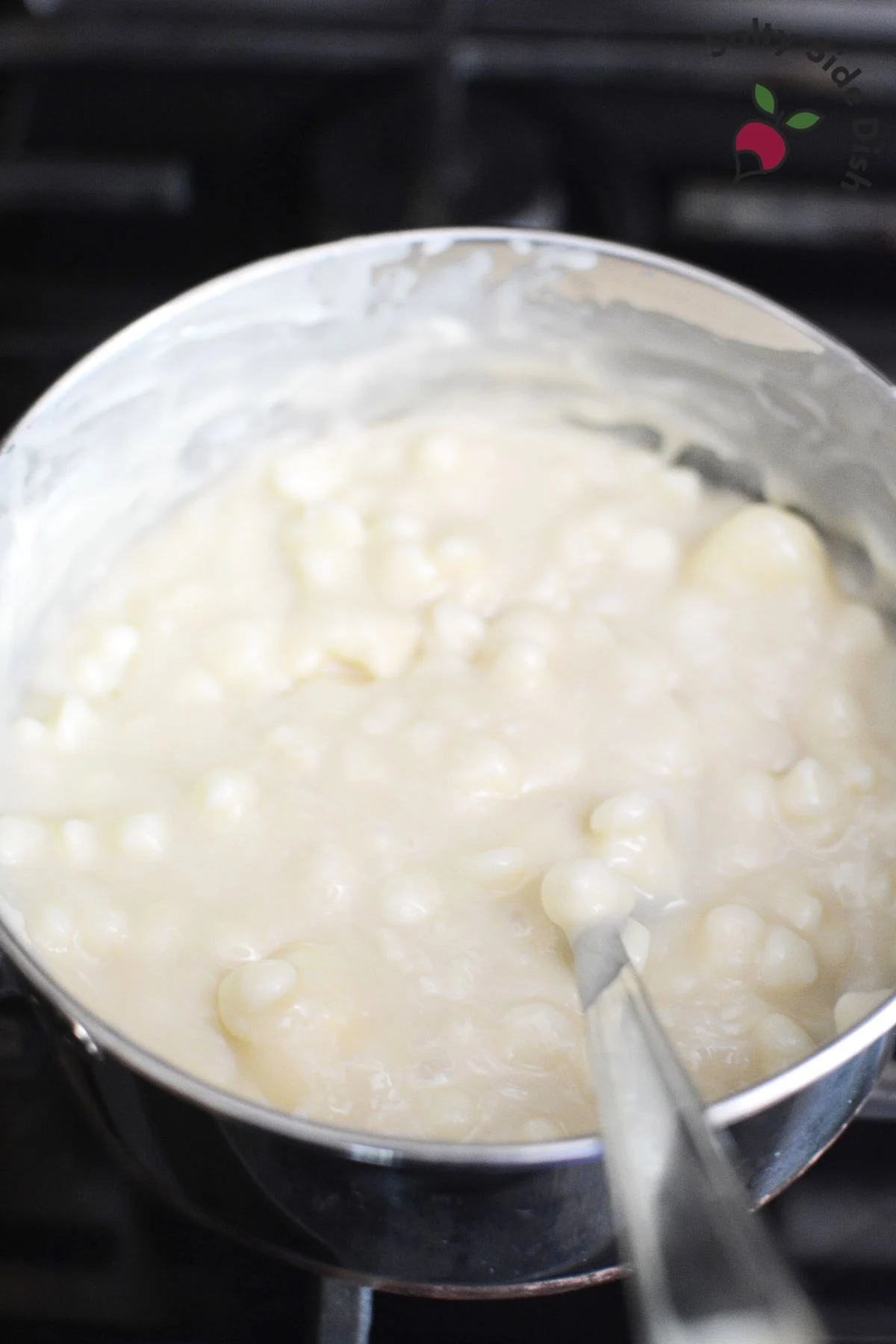 melted white chocolate chips in a sauce pan.