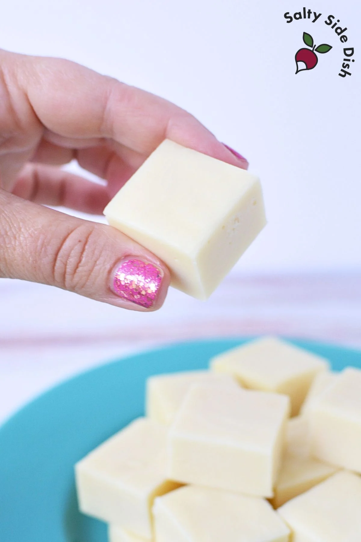 piece of white fudge being held.