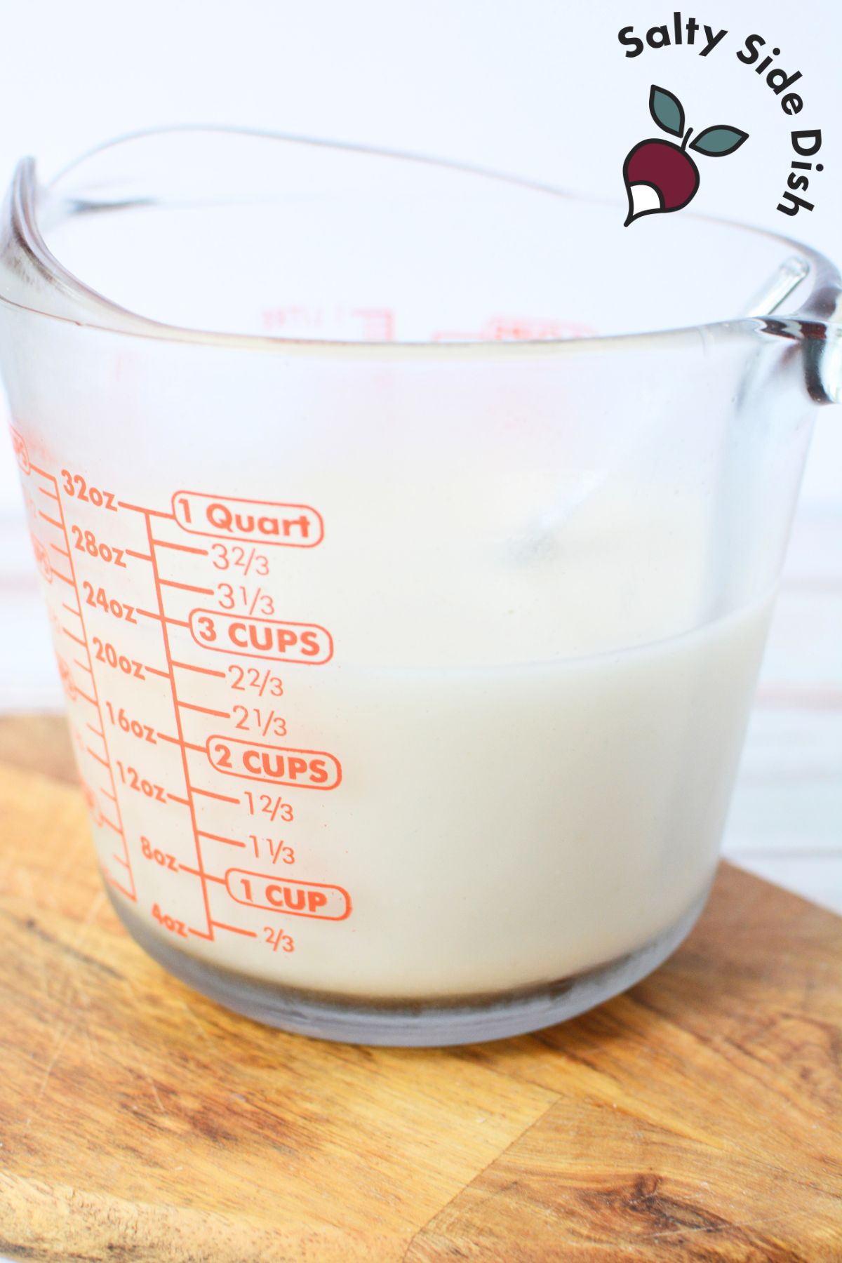 oat milk in a measuring cup.