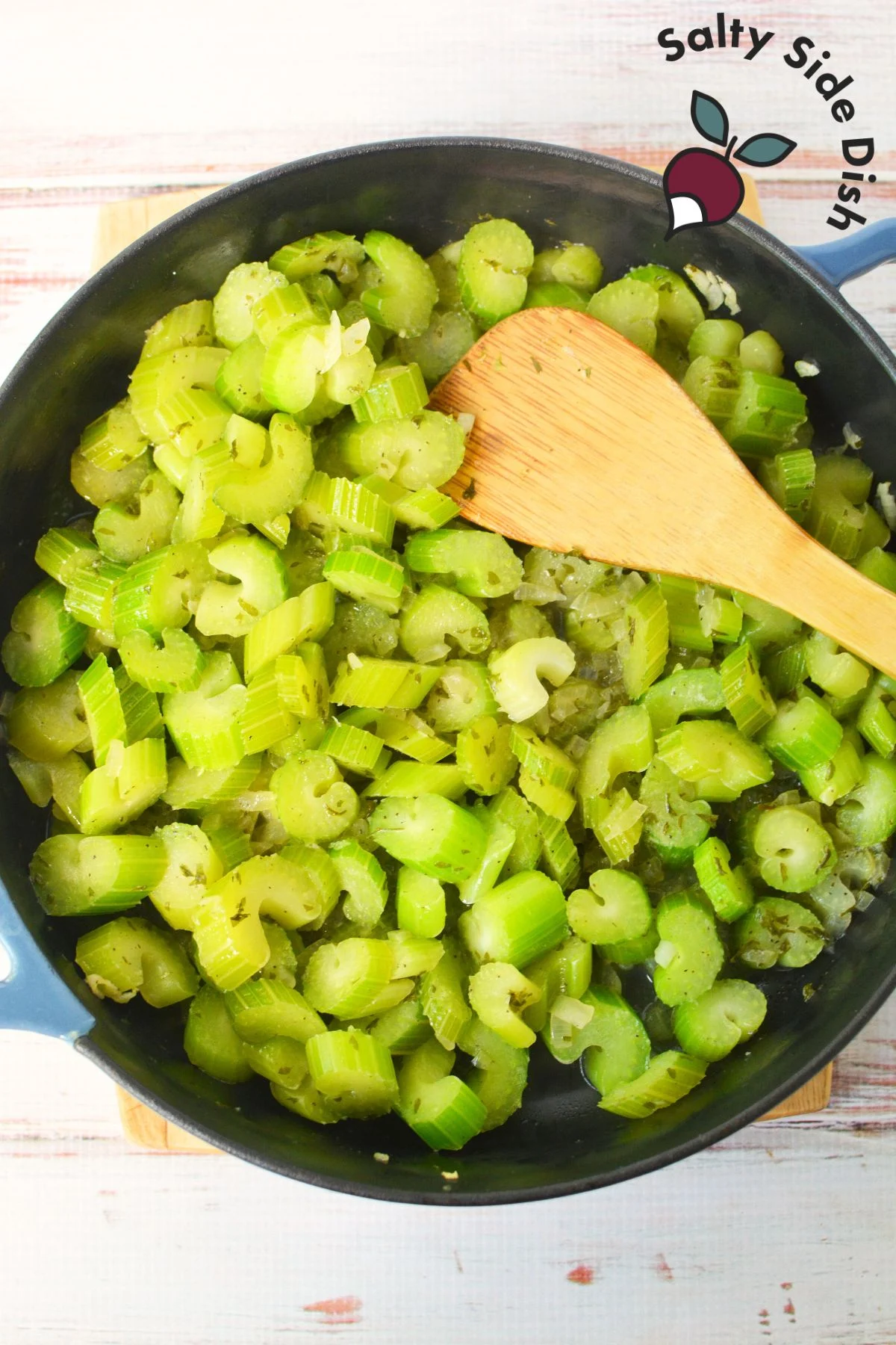 sautéing celery in a cast iron pan.