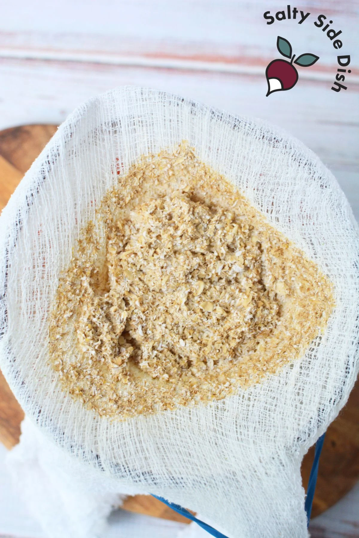straining pulp making oat milk.