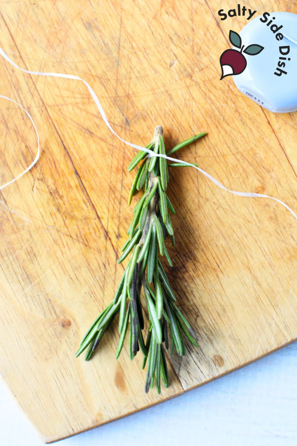 tie floss around rosemary