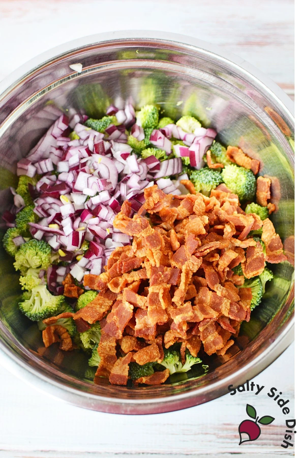 broccoli cranberry salad ingredients in a mixing bowl.