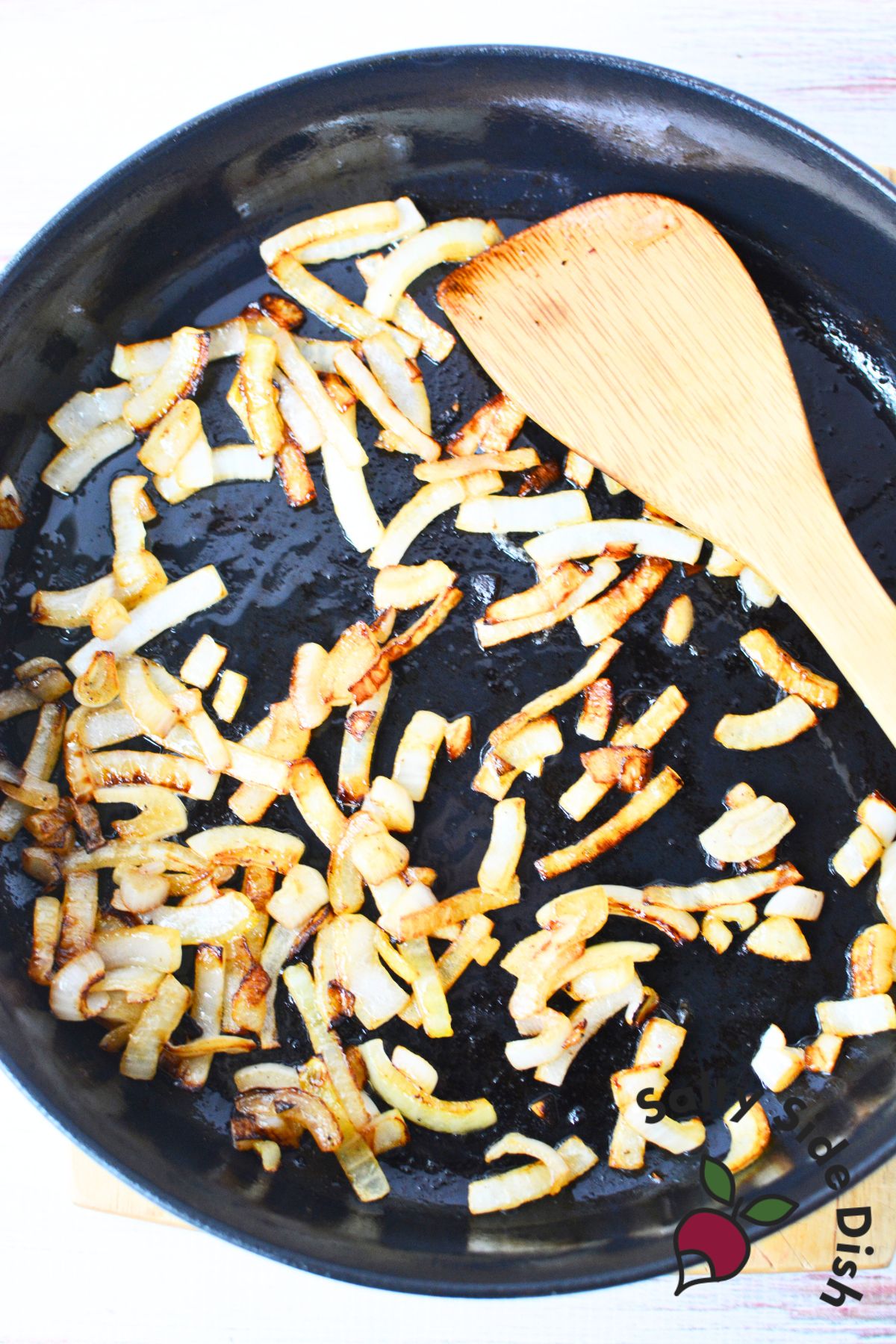 chopped onions in a cast iron skillet.