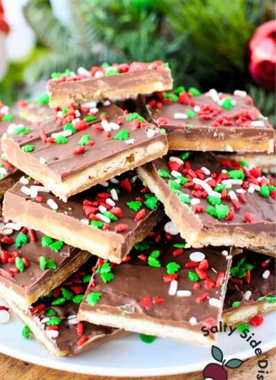 plate of saltine crackers with chocolate and sprinkles.