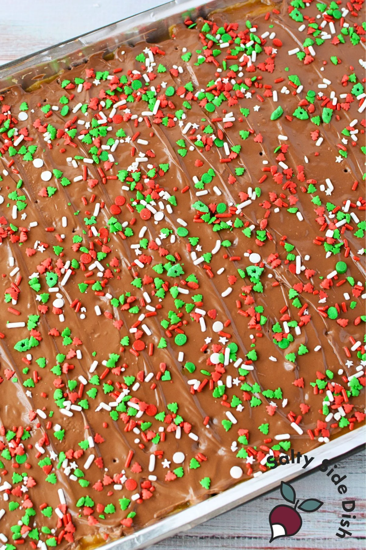 sheet pan of chocolate sprinkled homemade toffee crackers.