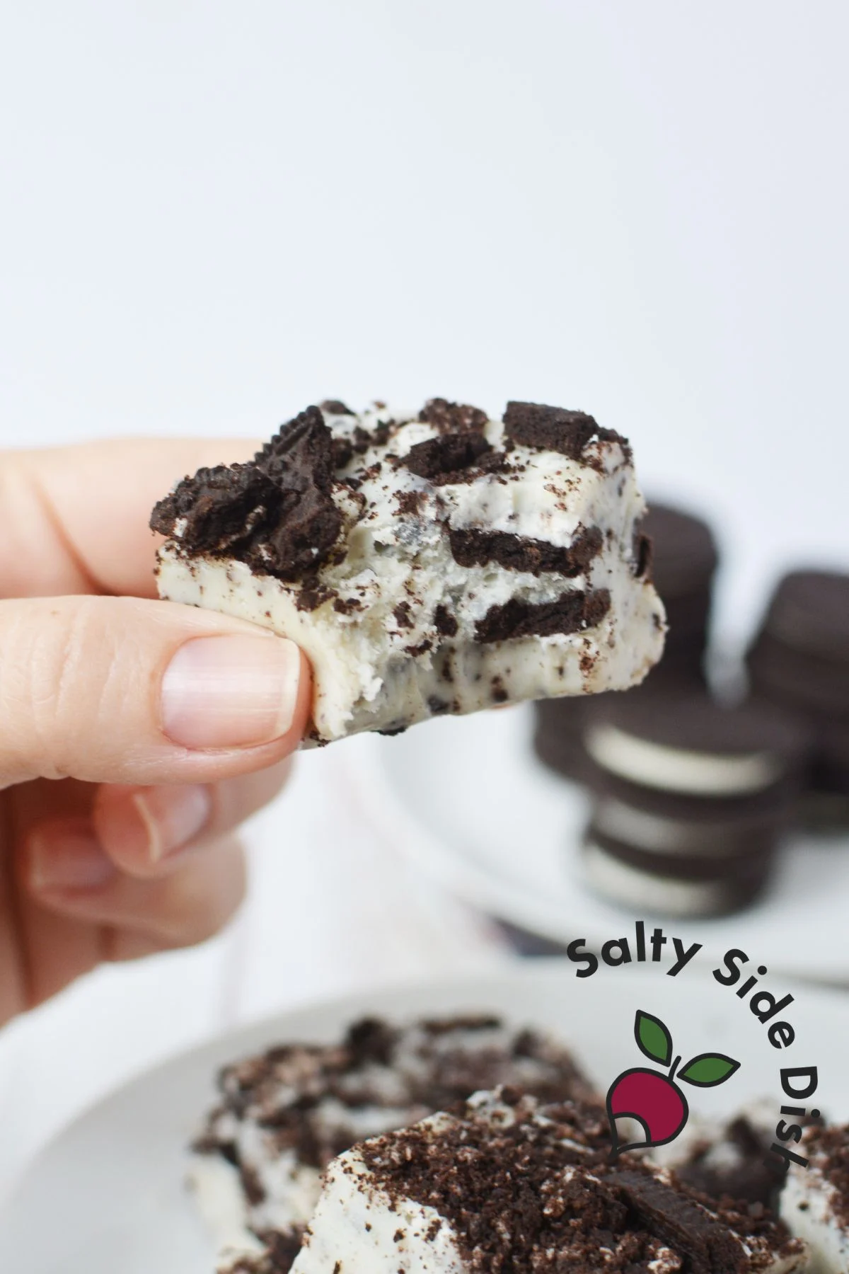 creamy oreo fudge with bite taken out of it.