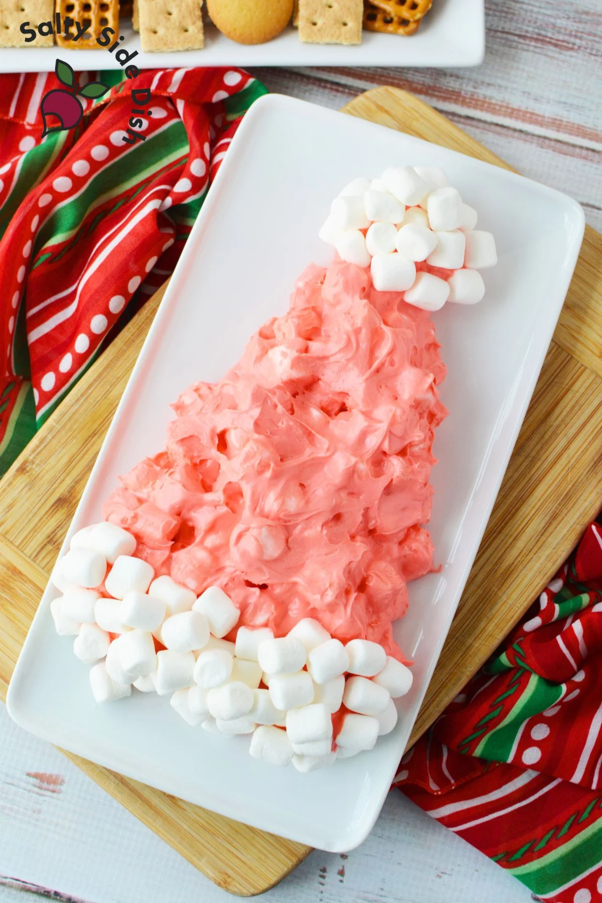 marshmallow dip shaped into a santa hat on a serving tray.