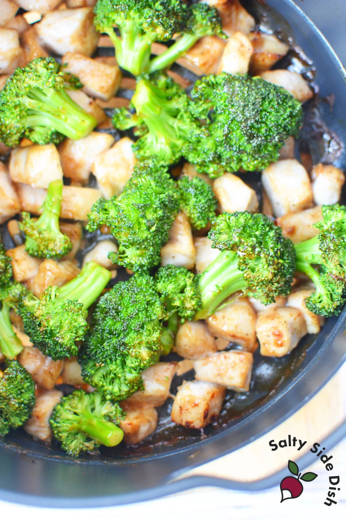 air fryer chicken and broccoli in air crisp basket.
