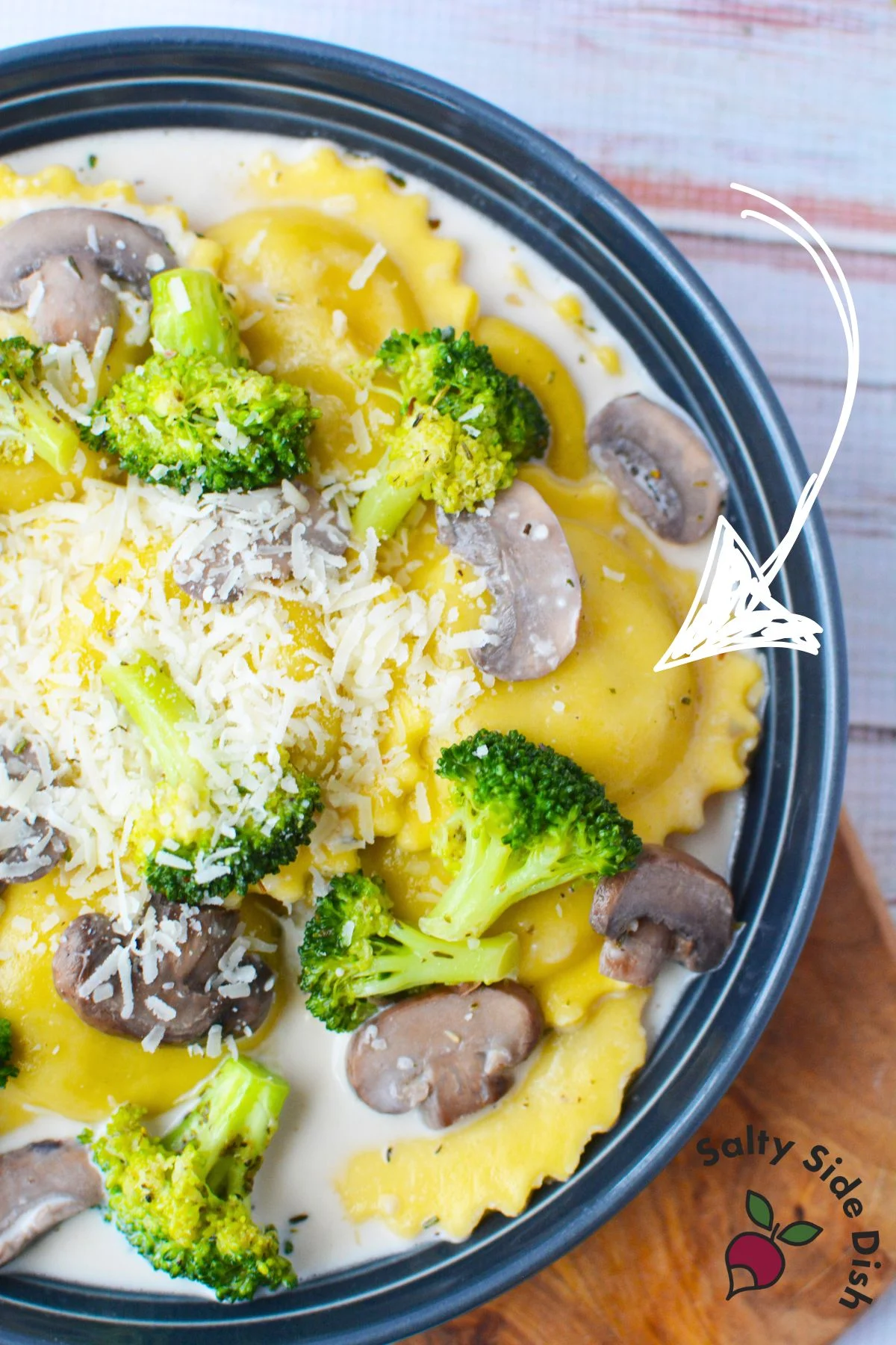 cast iron pan with ravioli and cream sauce.