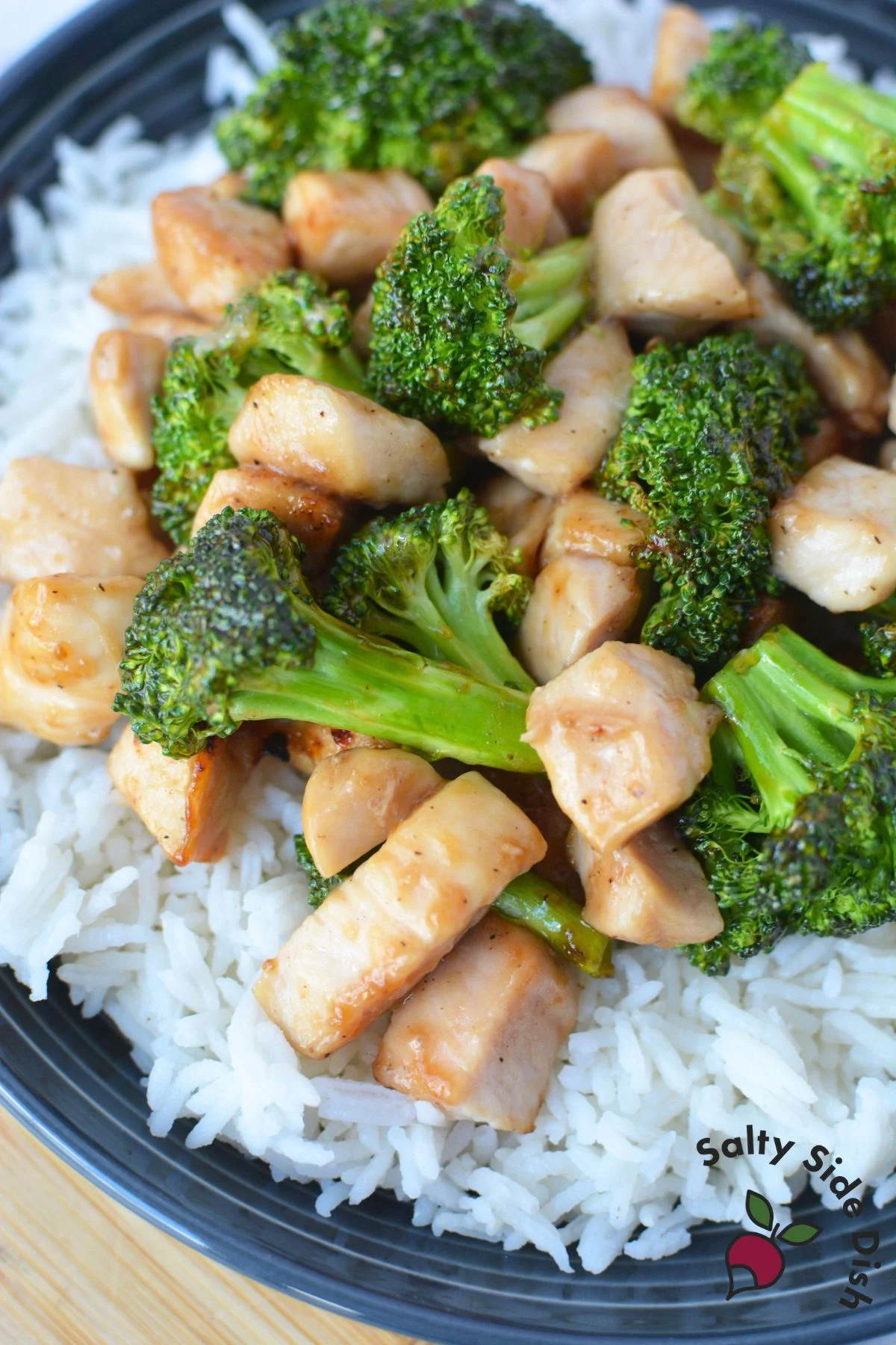 rice bowl dinner with chicken and broccoli florets.