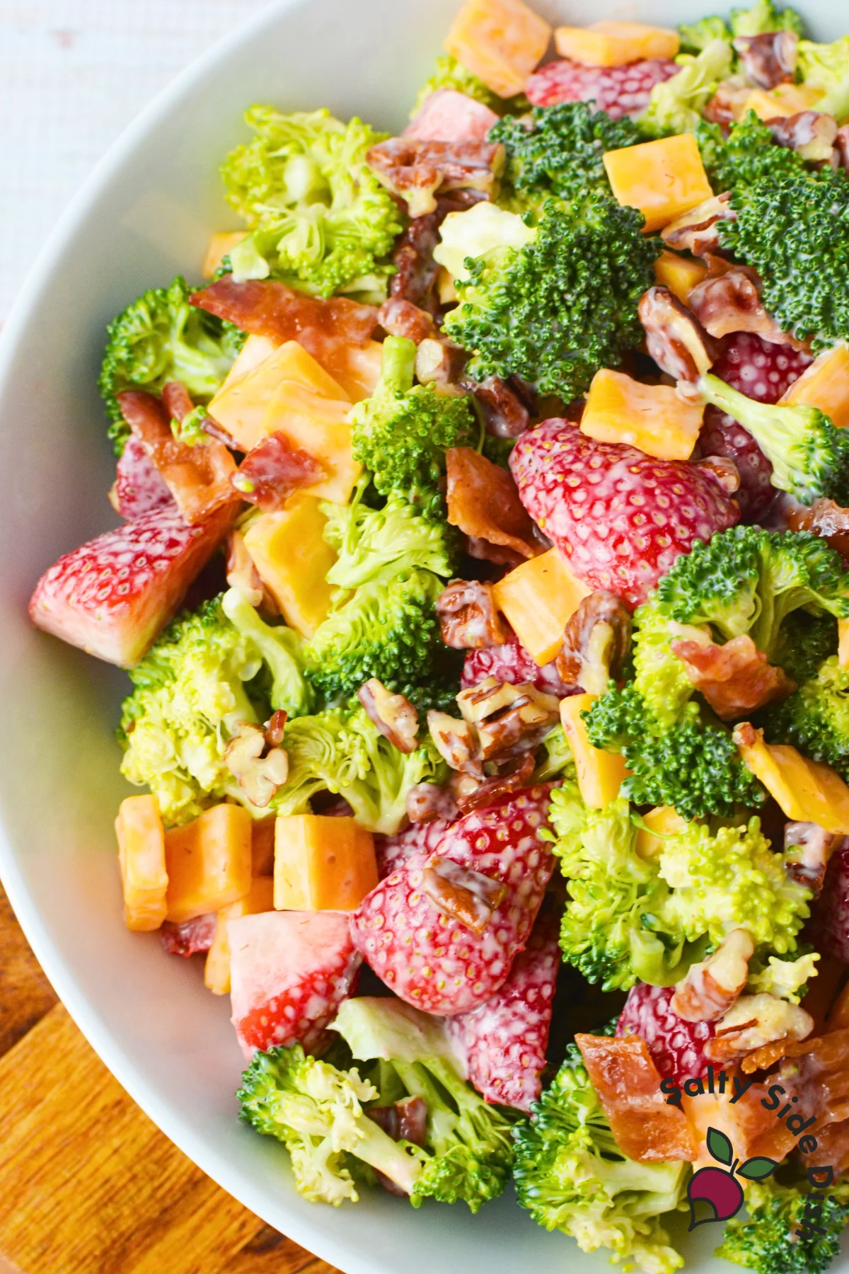 great strawberry salad recipe with broccoli in a large bowl.
