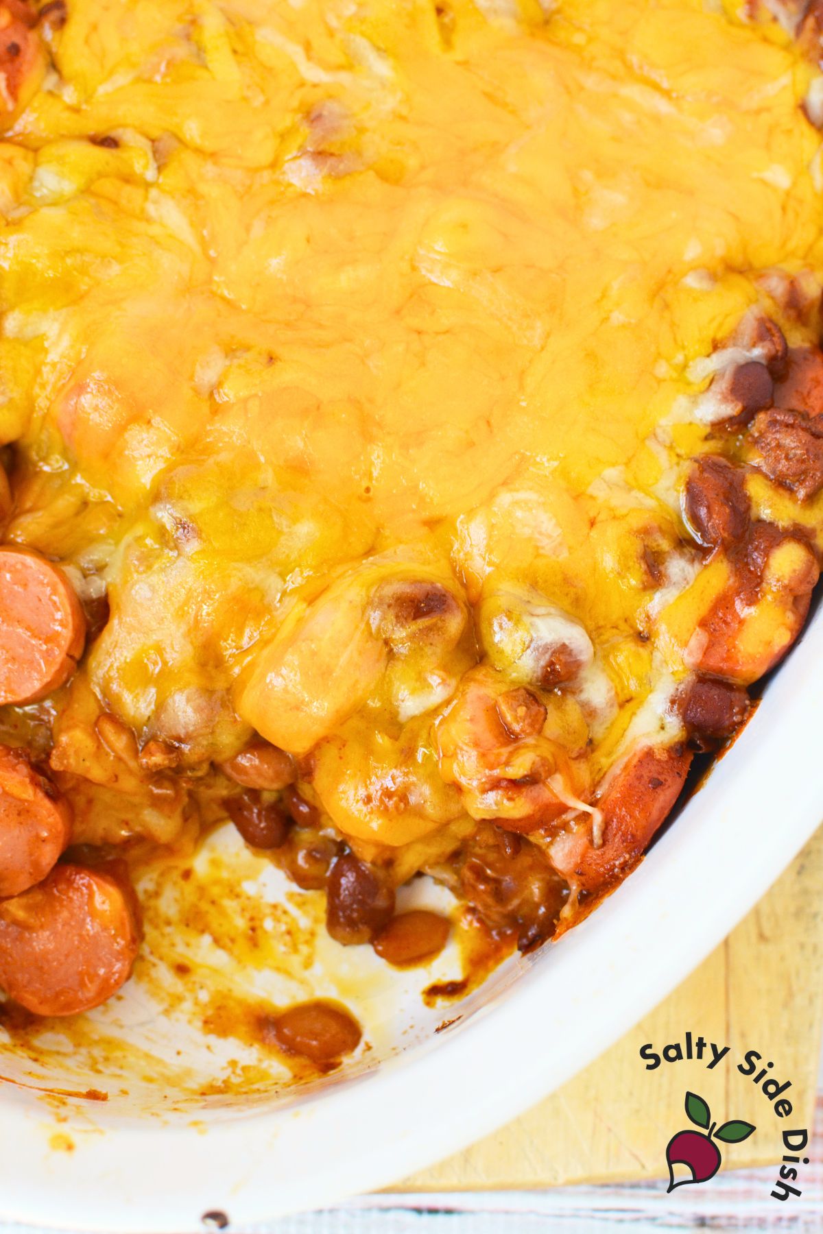 chili cheese casserole with scoop out of it.