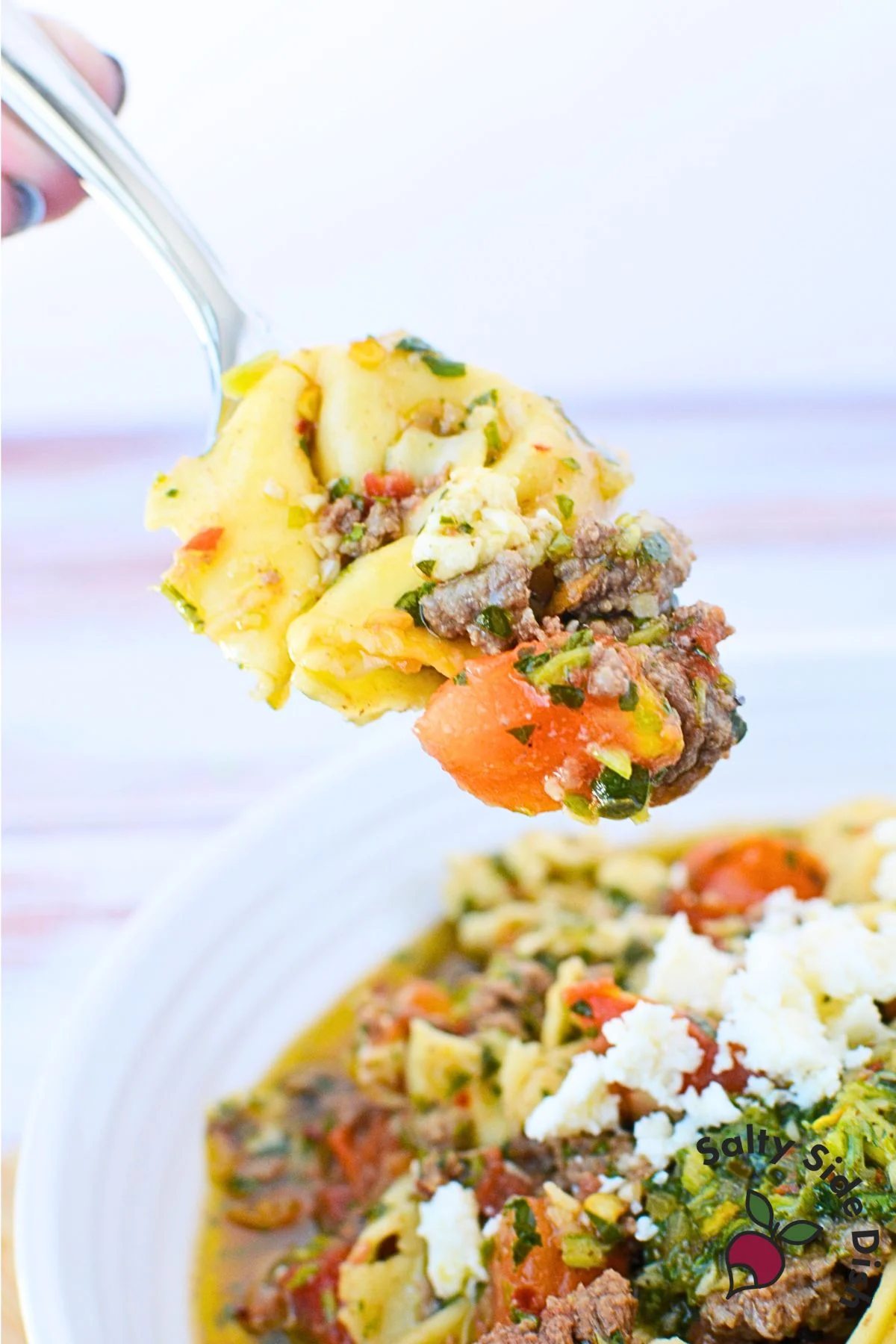 tortellini in a spoon.