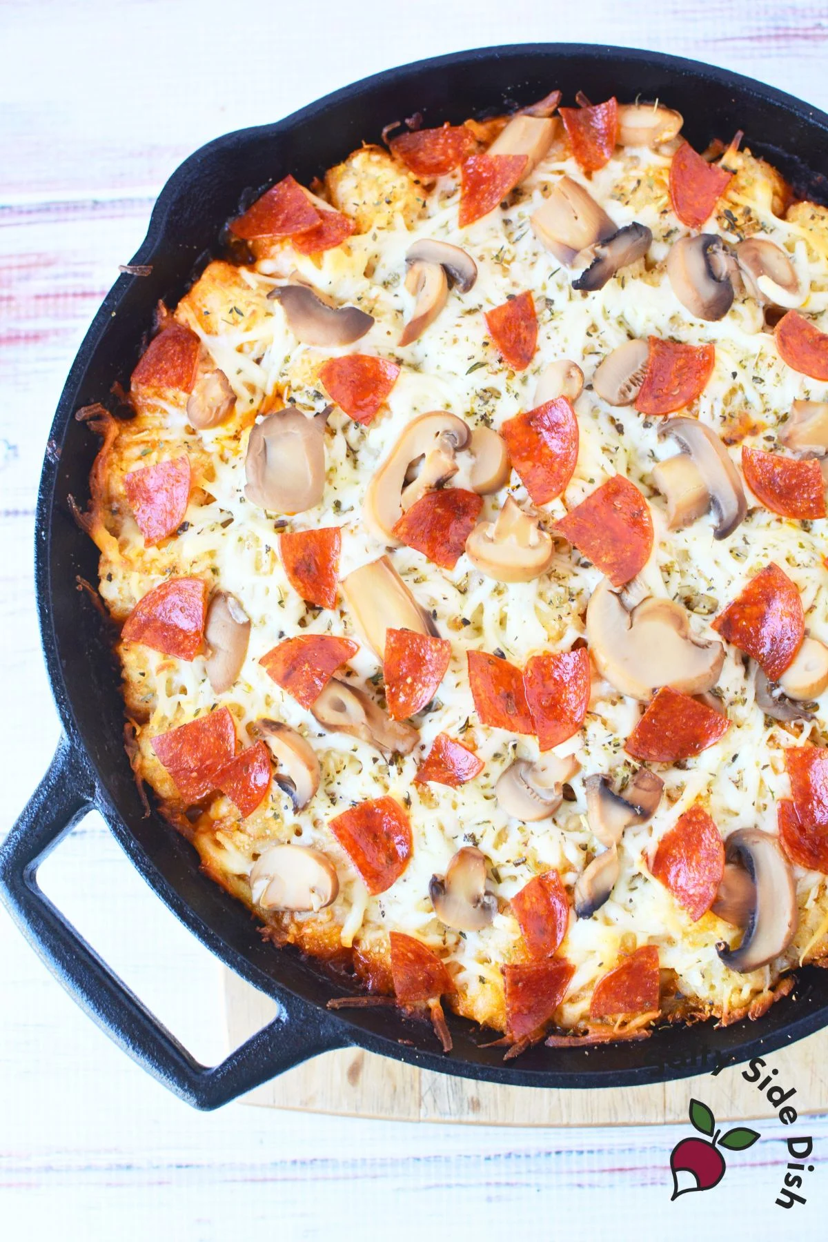 layered cast iron casserole with tater tots.