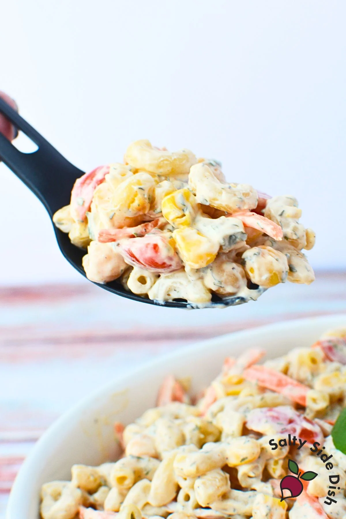bbq ranch chickpea pasta salad in a serving spoon.