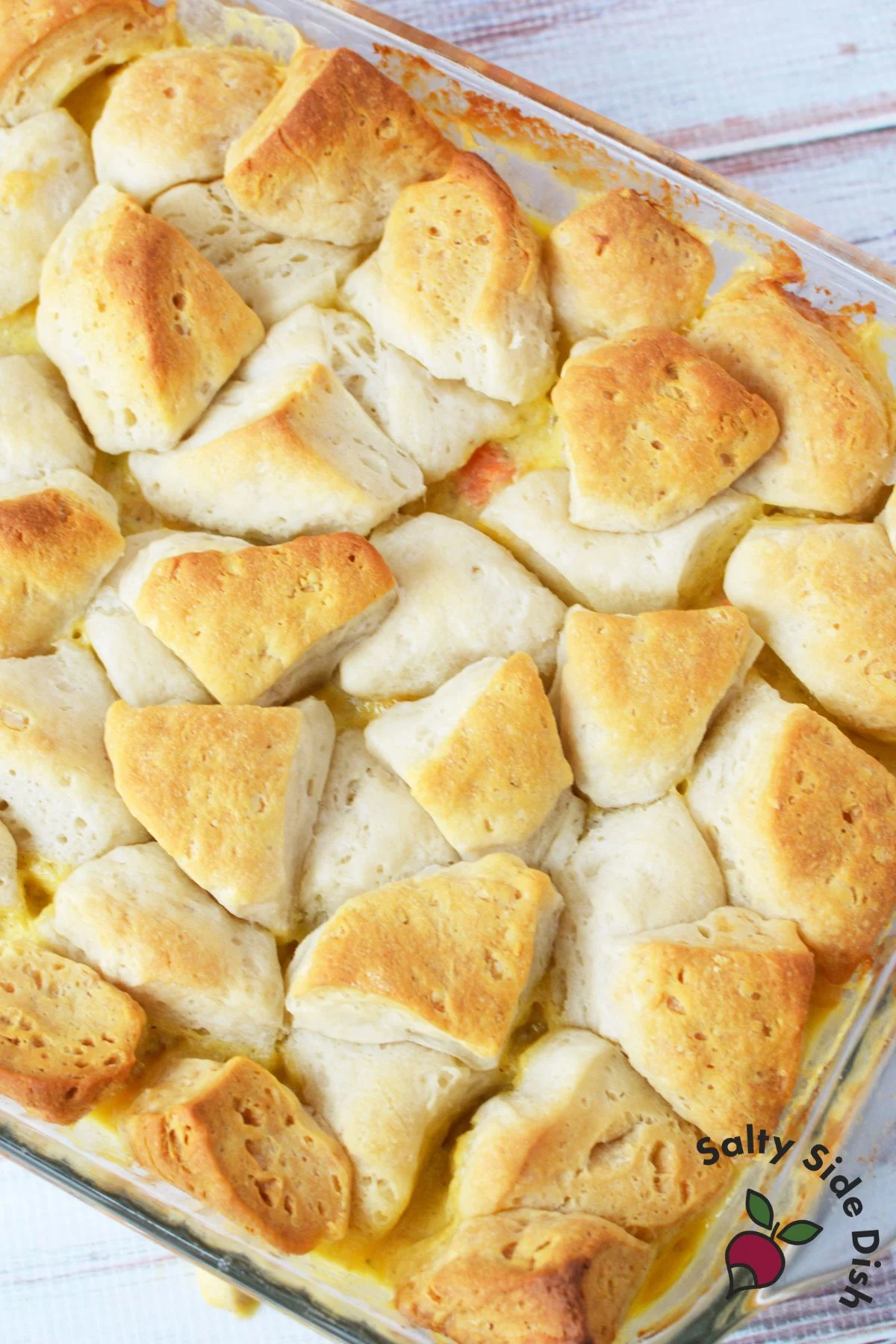 Golden biscuit topping on baked chicken pot pie casserole.