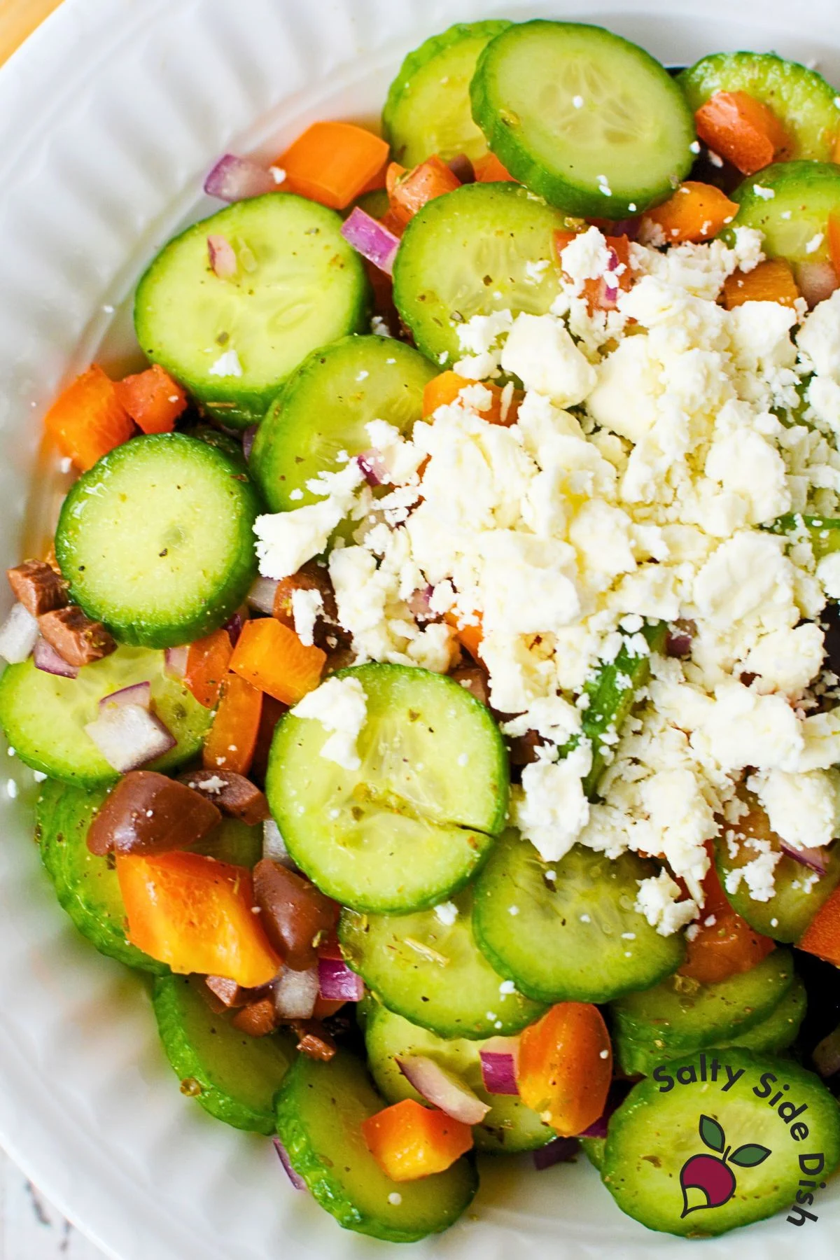 Mediterranean Cucumber Salad recipe in a white bowl.
