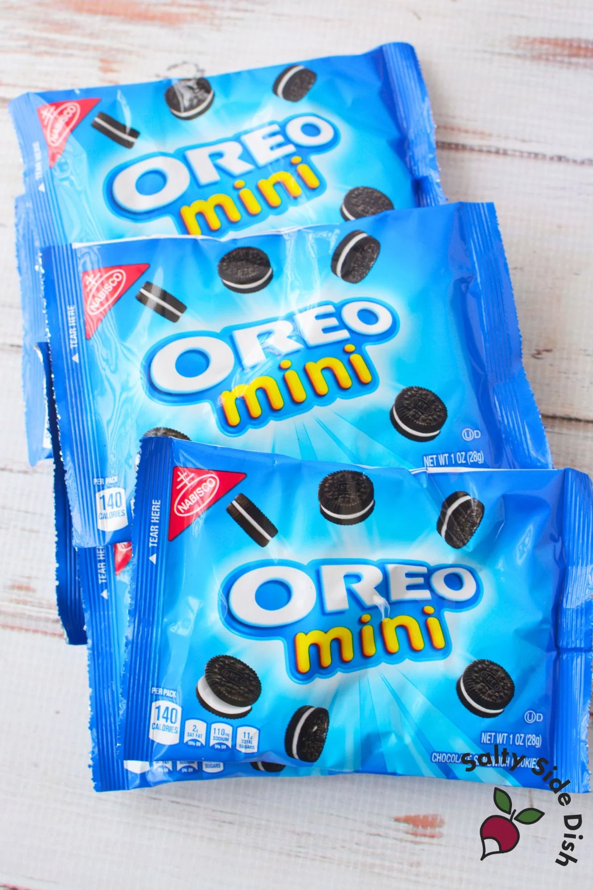 Stacked sealed mini Oreo snack bags before preparation for dirt in a bag desserts.