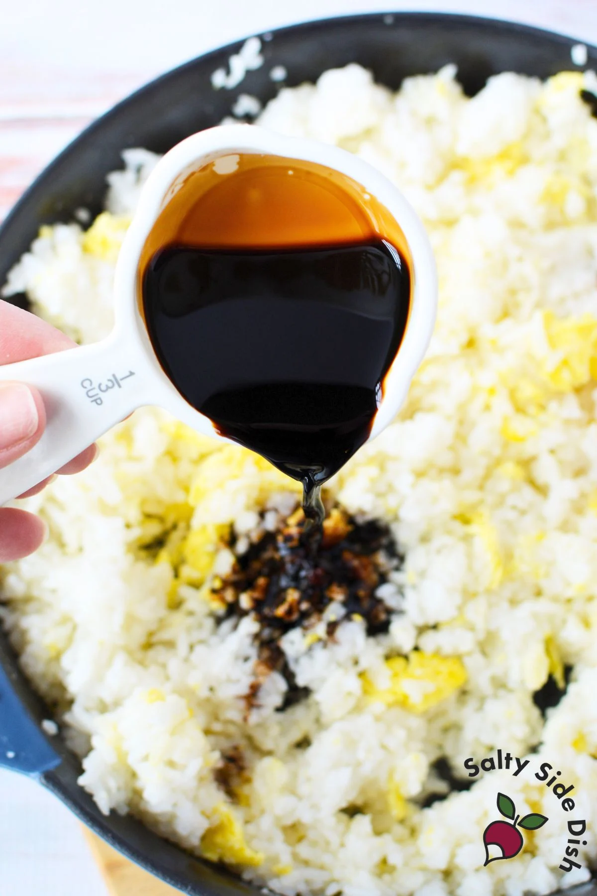 Lightly scrambled eggs in a skillet, ready for jasmine fried rice