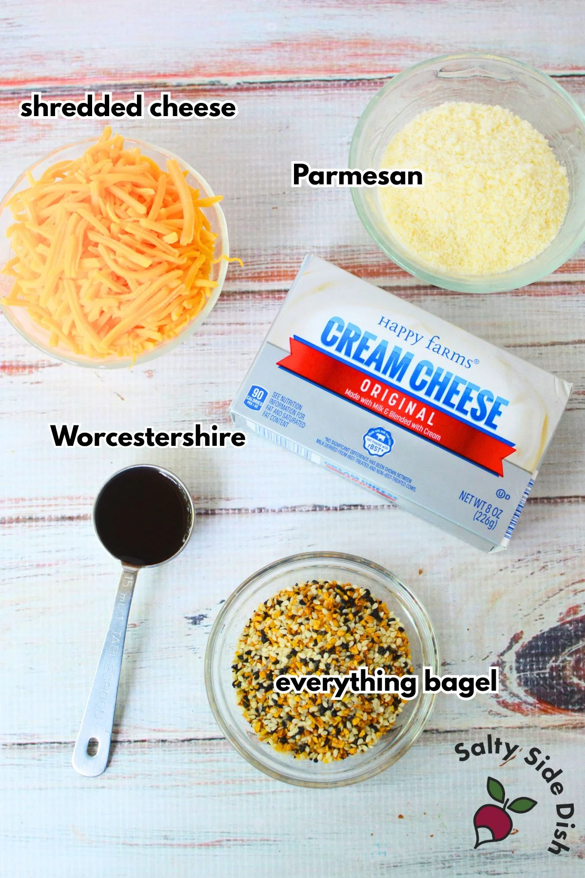 Ingredients for everything bagel cheese ball including cream cheese, cheddar, Parmesan, Worcestershire, and seasoning