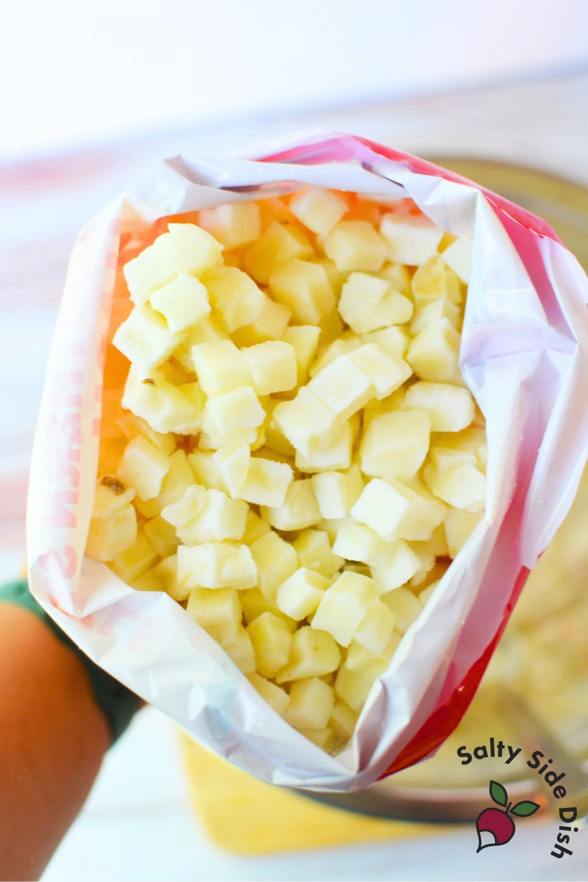 Open bag of frozen Southern-style diced potatoes used in sour cream and onion mashed potato casserole.