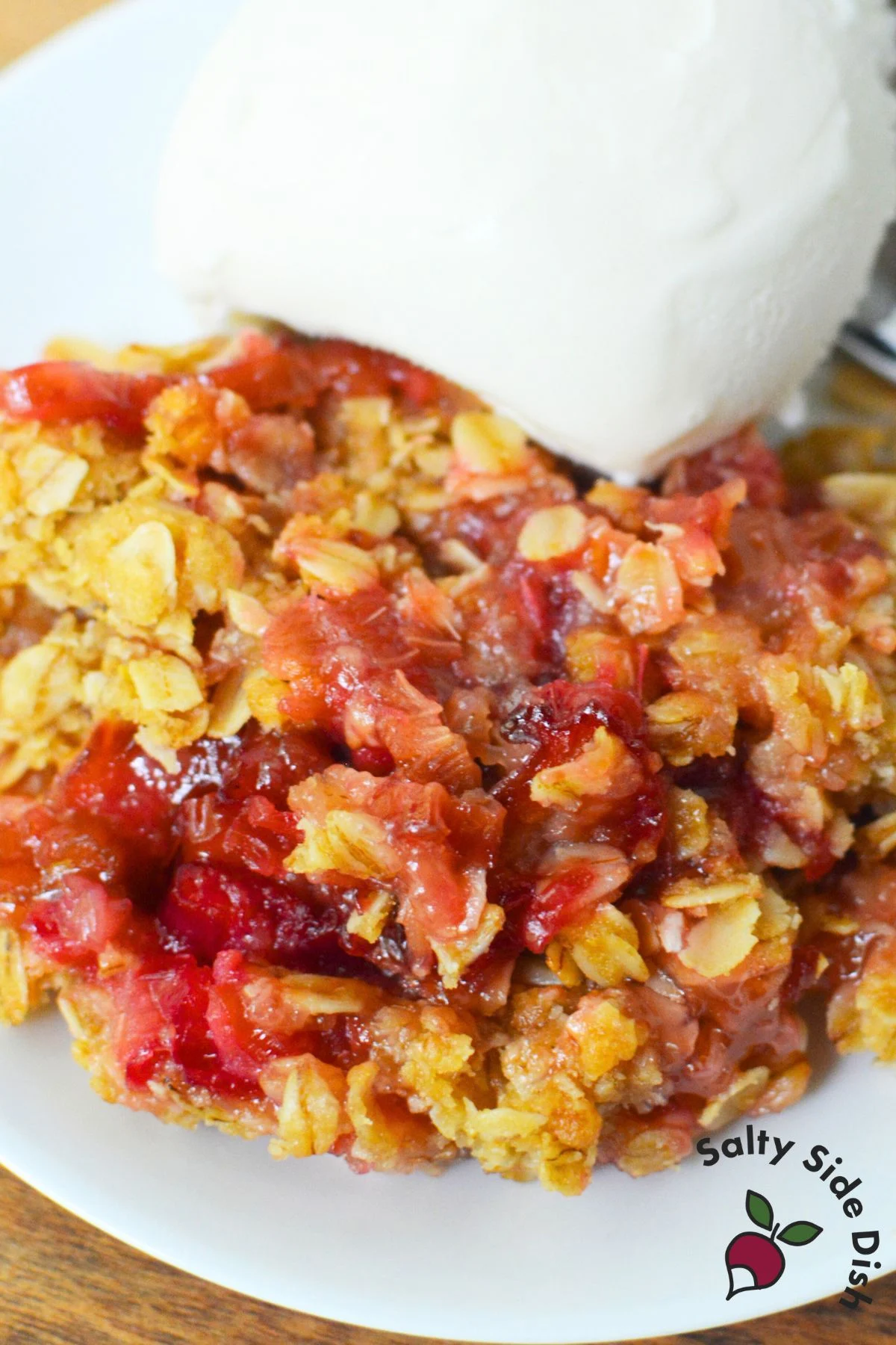 How to make an oat crumble topping for rhubarb crisp, with oats, brown sugar, flour, and butter ready for baking in a skillet.