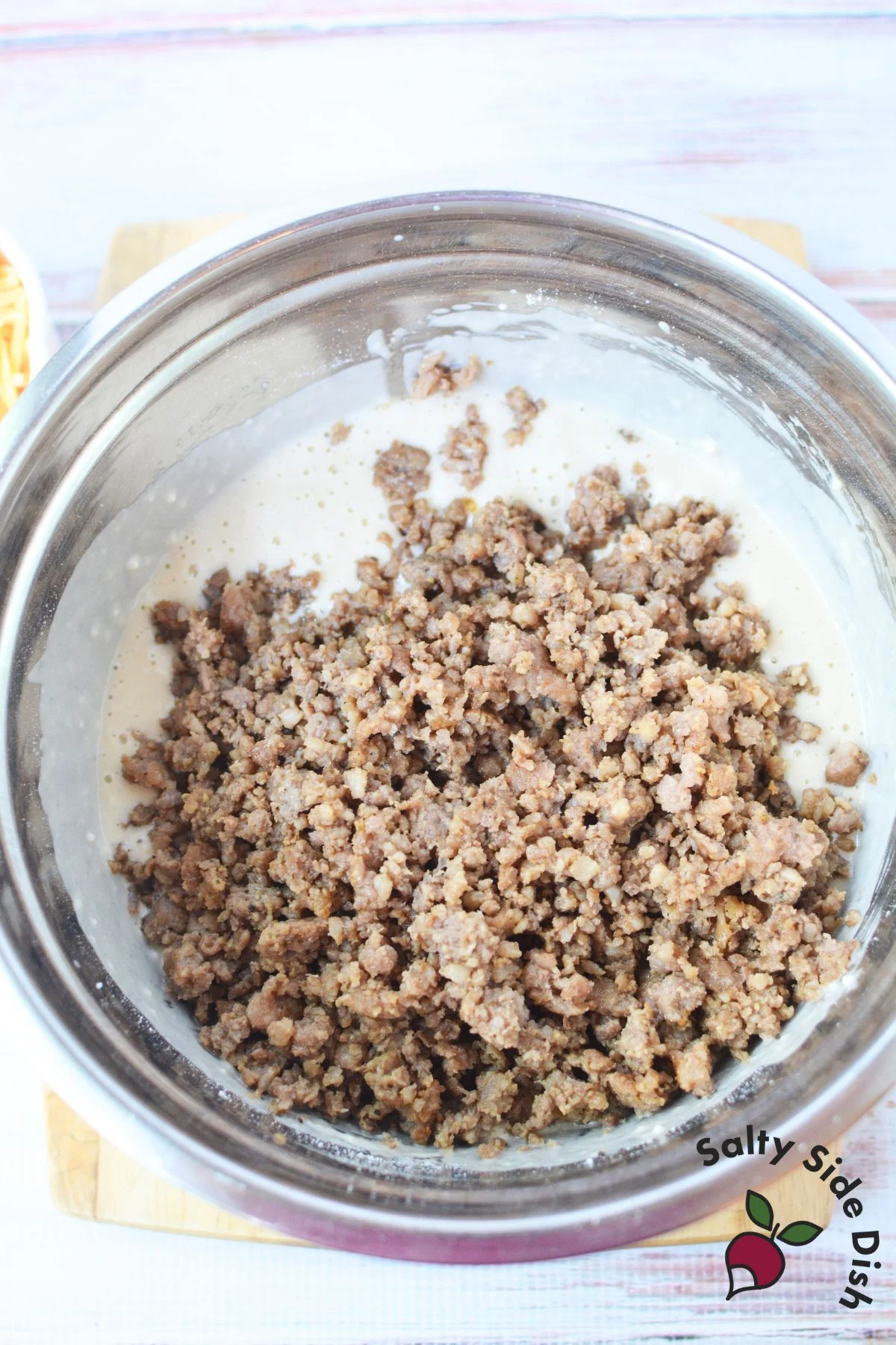Cooked sausage added to pancake batter for homemade McGriddle muffins