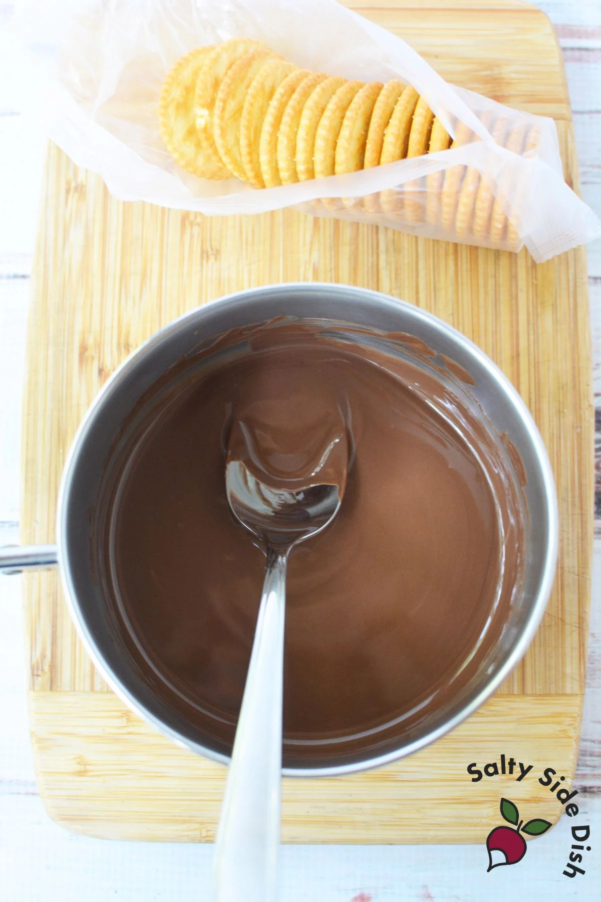 Smooth melted Andes chocolate in saucepan with spoon