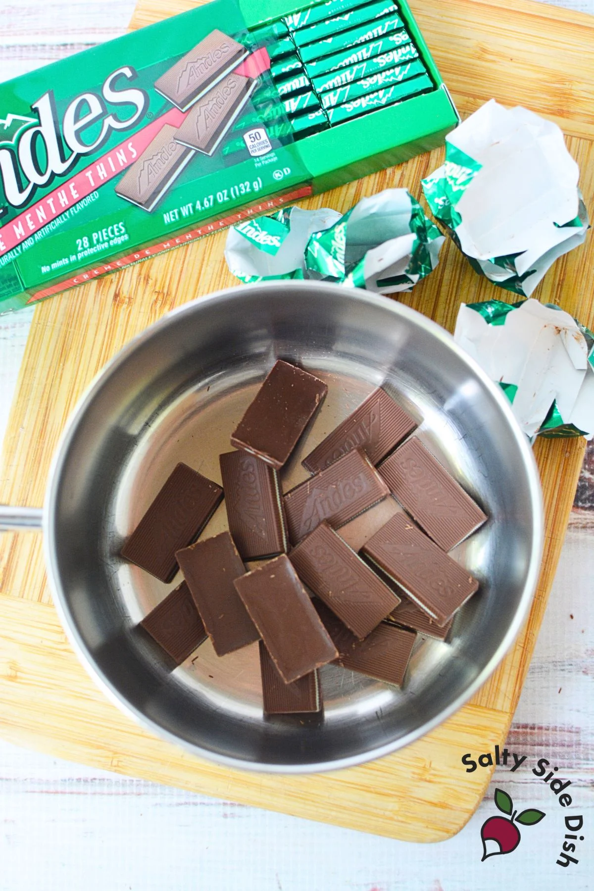 Unwrapped Andes mint chocolates in saucepan ready to melt