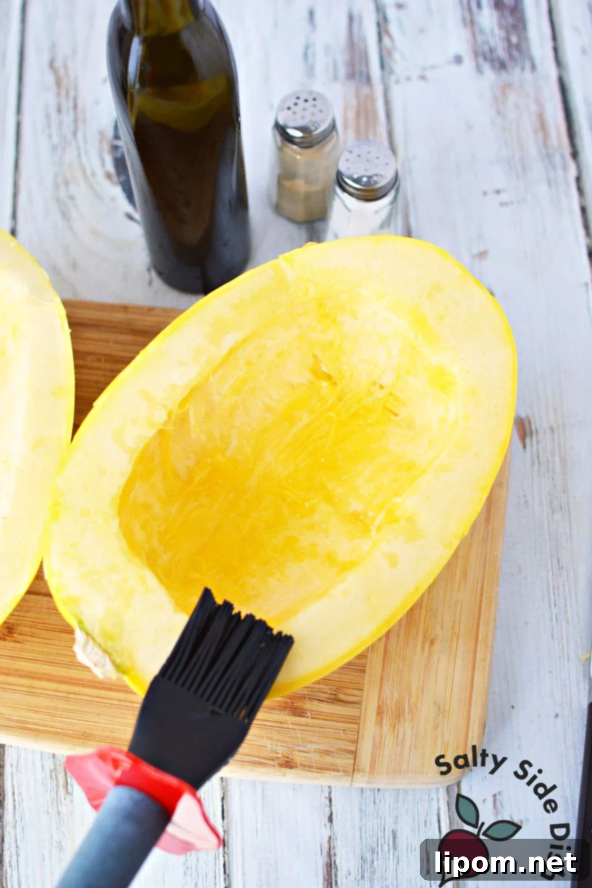 Mastering Spaghetti Squash 5 adding oil onto outside of squash.